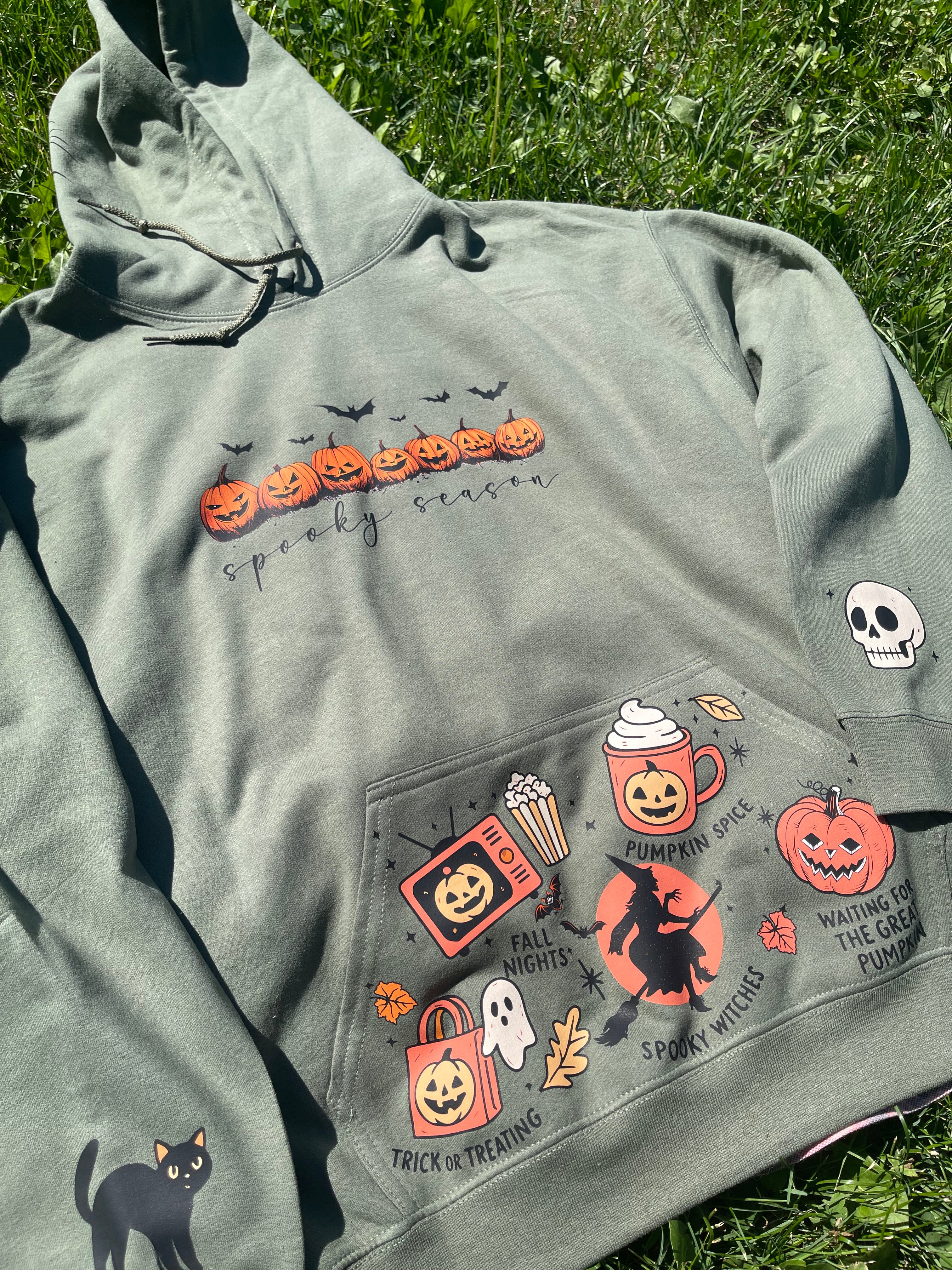 military Green with Halloween-themed patches on a grassy background